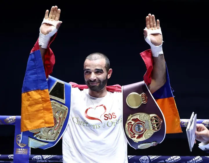 Yuri Sakunts — champion with title belts